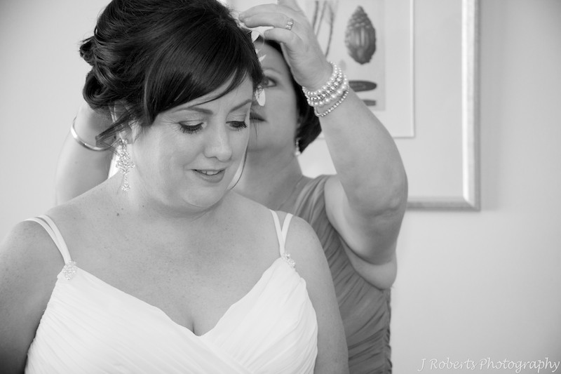 Bride having final touches put in her hair - wedding photography sydney